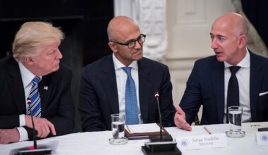 President Donald Trump speaks with Satya Nadella, Chief Executive Officer of Microsoft, and Jeff Bezos, Chief Executive Officer of Amazon
