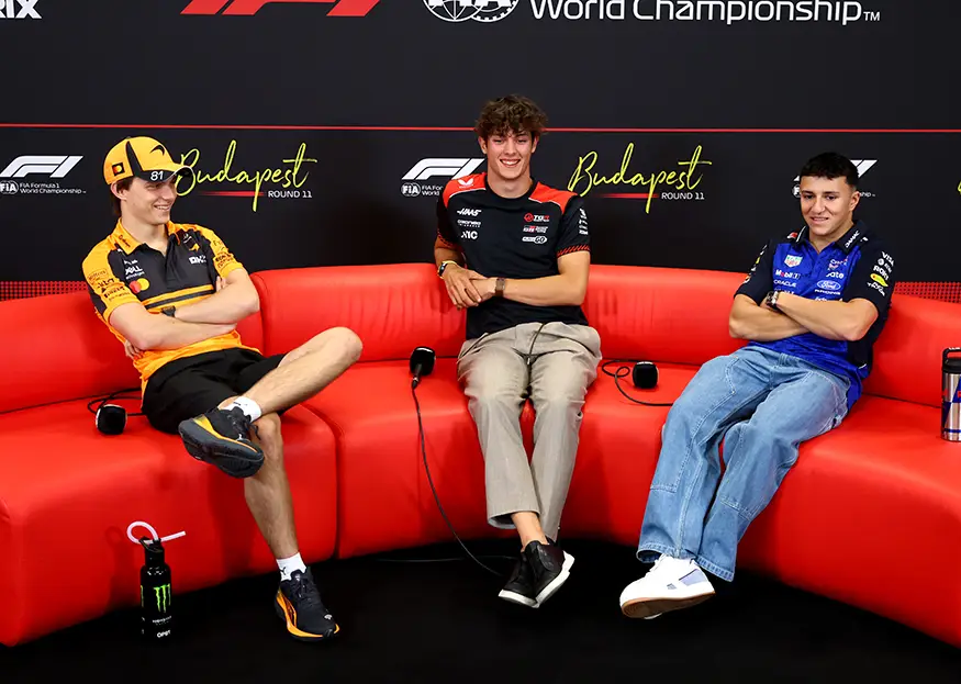 Oscar Piastri, Oliver Bearman and Isack Hadjar seated during the 2026 Hungarian Grand Prix press conference.