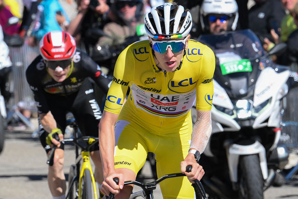 UAE Team Emirates - XRG team's Slovenian rider Tadej Pogacar wearing the overall leader's yellow jersey and Team Visma - Lease a bike team's Danish rider Jonas Vingegaard cycles in the ascent of Mont Ventoux during the 16th stage of the 112th edition of the Tour de France cycling race, 171.5 km between Montpellier and Mont Ventoux, southern France, on July 22, 2025. (Photo by Bernard PAPON / AFP)
