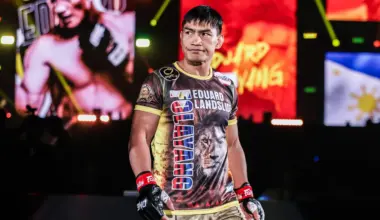 Filipino MMA fighter Joshua Pacio celebrates a win with his team