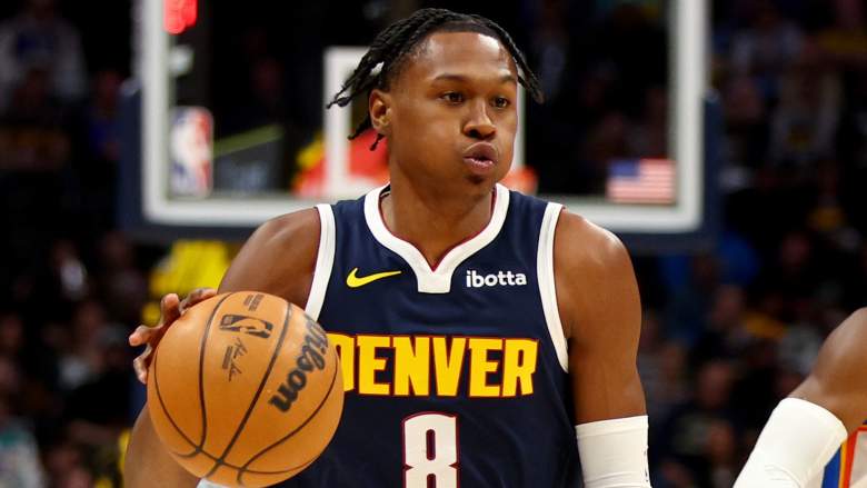 Peyton Watson #8 of the Denver Nuggets was spotted talking with Lakers Gm Rob Pelinka.