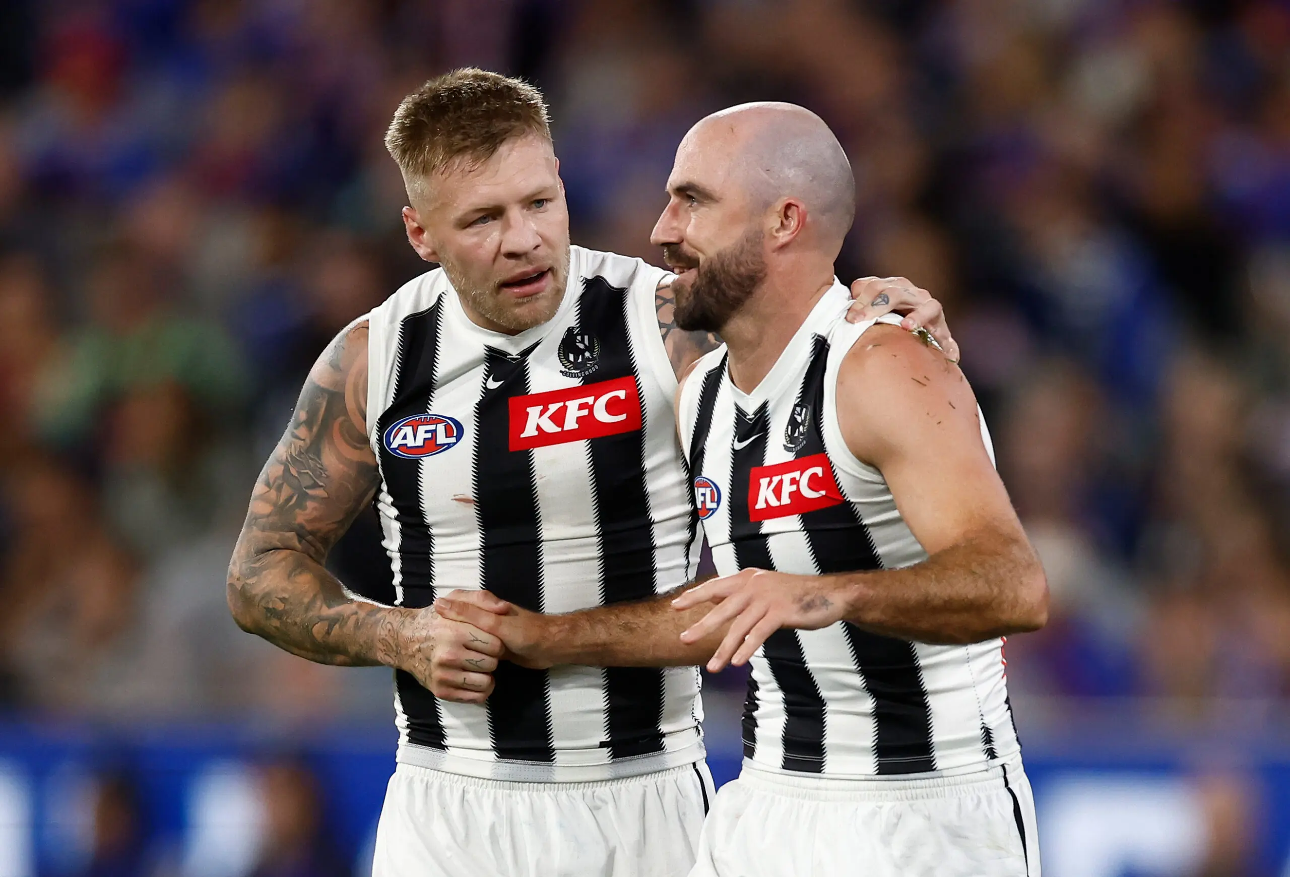 MELBOURNE, AUSTRALIA - MARCH 21: Jordan De Goey (left) and Steele Sidebottom of the Magpies are seen during the 2025 AFL Round 02 match between the Footscray Bulldogs and the Collingwood Magpies at the Melbourne Cricket Ground on March 21, 2025 in Melbourne, Australia. (Photo by Michael Willson/AFL Photos via Getty Images)