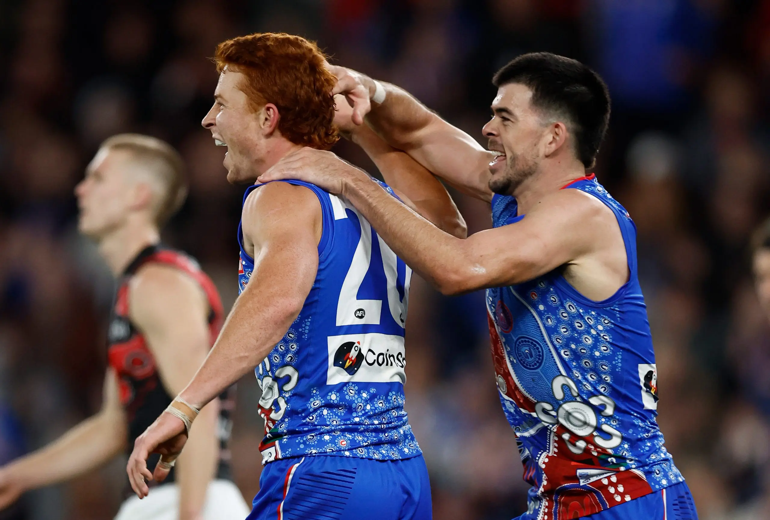 MELBOURNE, AUSTRALIA - MAY 17: Ed Richards (left) and Matthew Kennedy of the Bulldogs celebrate during the 2025 AFL Round 10 match between the Western Bulldogs and the Essendon Bombers at Marvel Stadium on May 17, 2025 in Melbourne, Australia. (Photo by Michael Willson/AFL Photos via Getty Images)