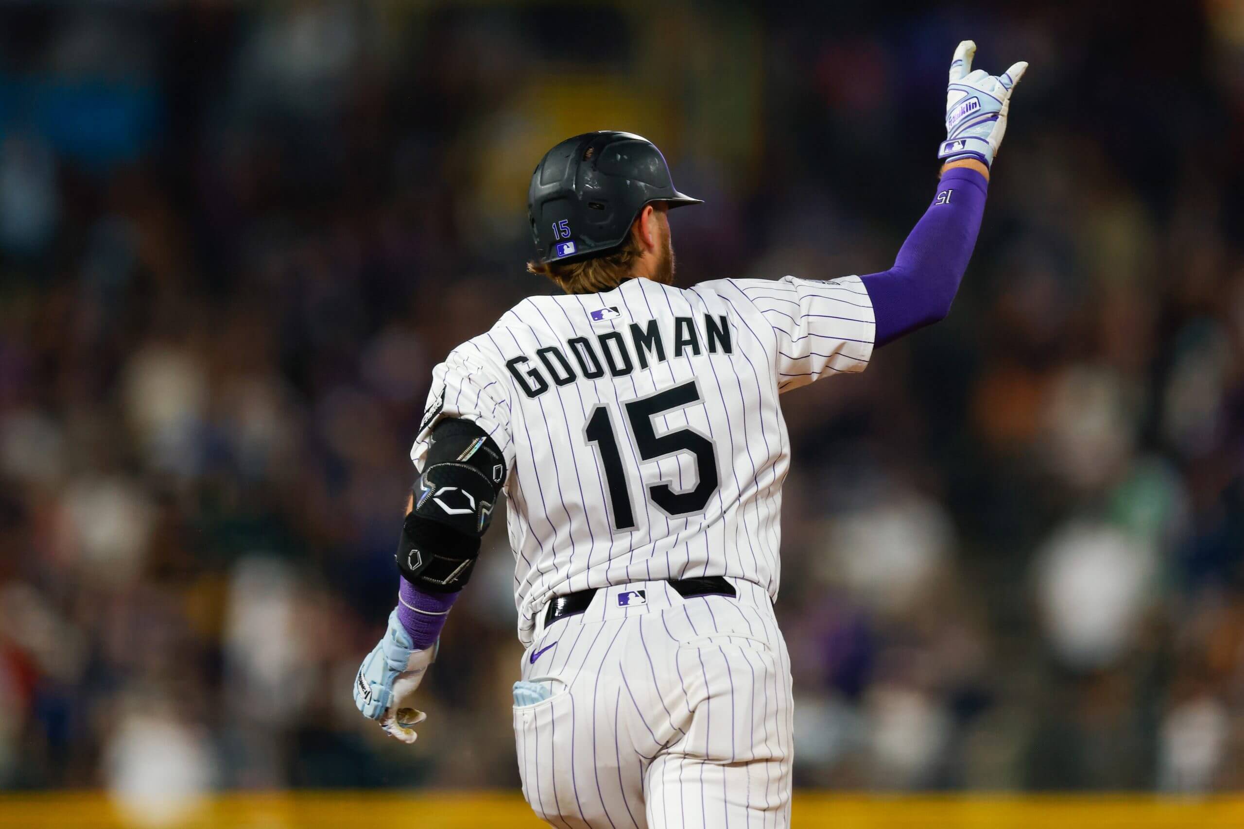 Hunter Goodman #15 of the Colorado Rockies celebrates towards the bullpen as he runs the bases after hitting a solo home run in the sixth inning against the San Diego Padres at Coors Field on September 6, 2025 in Denver, Colorado.