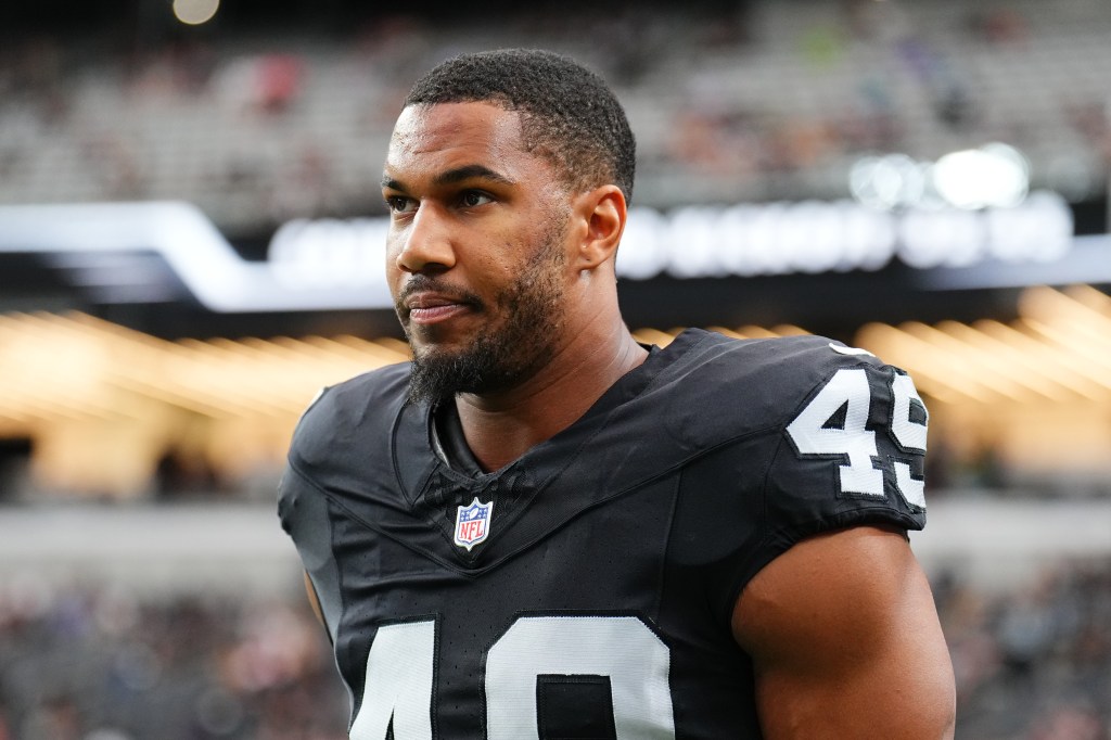 Las Vegas Raiders player wearing a black jersey with the number 49.