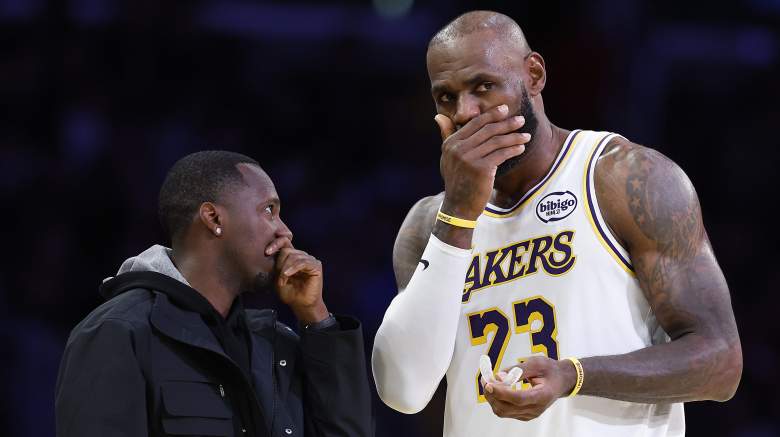 Rich Paul speaks privately with LeBron James on the court before a Los Angeles Lakers game.