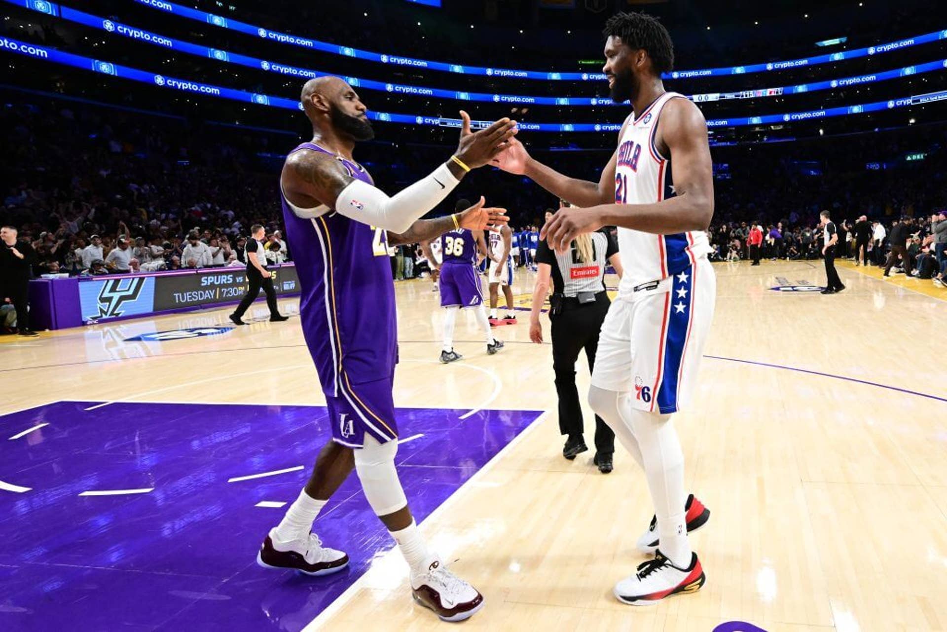 LeBron James and Joel Embiid shake hands after a February game between the Lakers and Sixers.