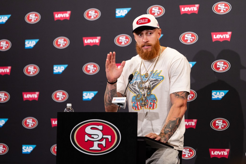George Kittle of the San Francisco 49ers speaks at a press conference.