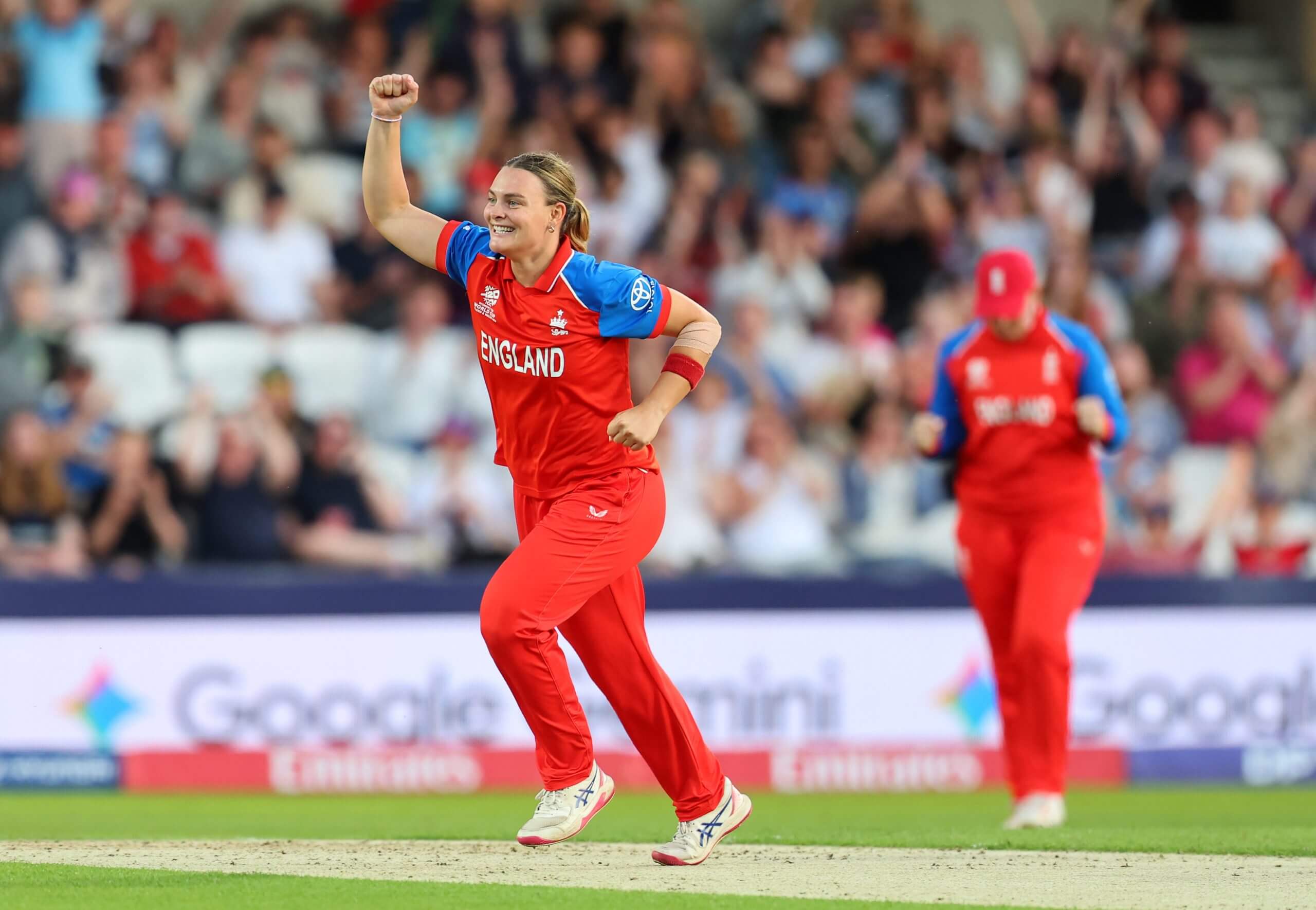 Dani Gibson celebrates taking a wicket for England against Scotland