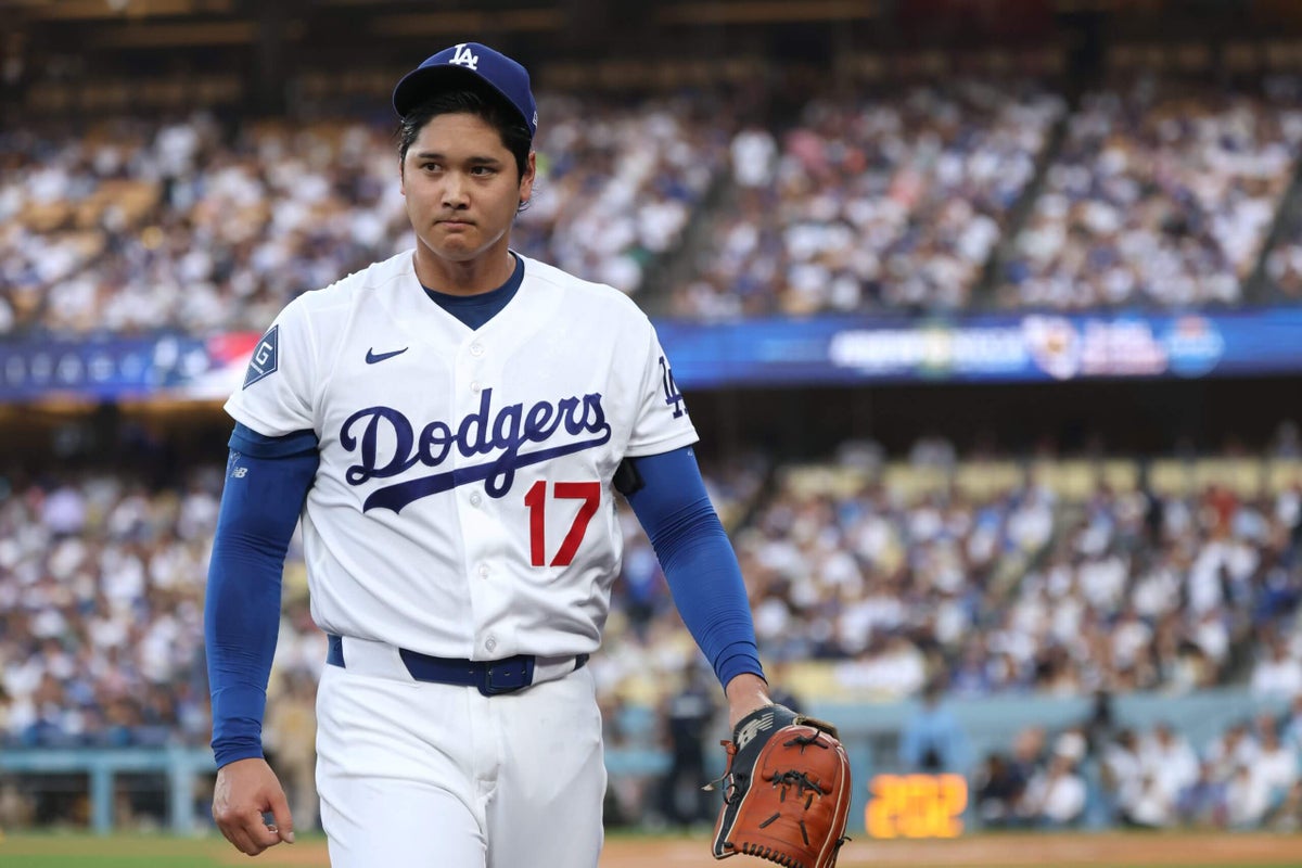 Dodgers’ Shohei Ohtani lifted for pinch hitter after he feels something while swinging