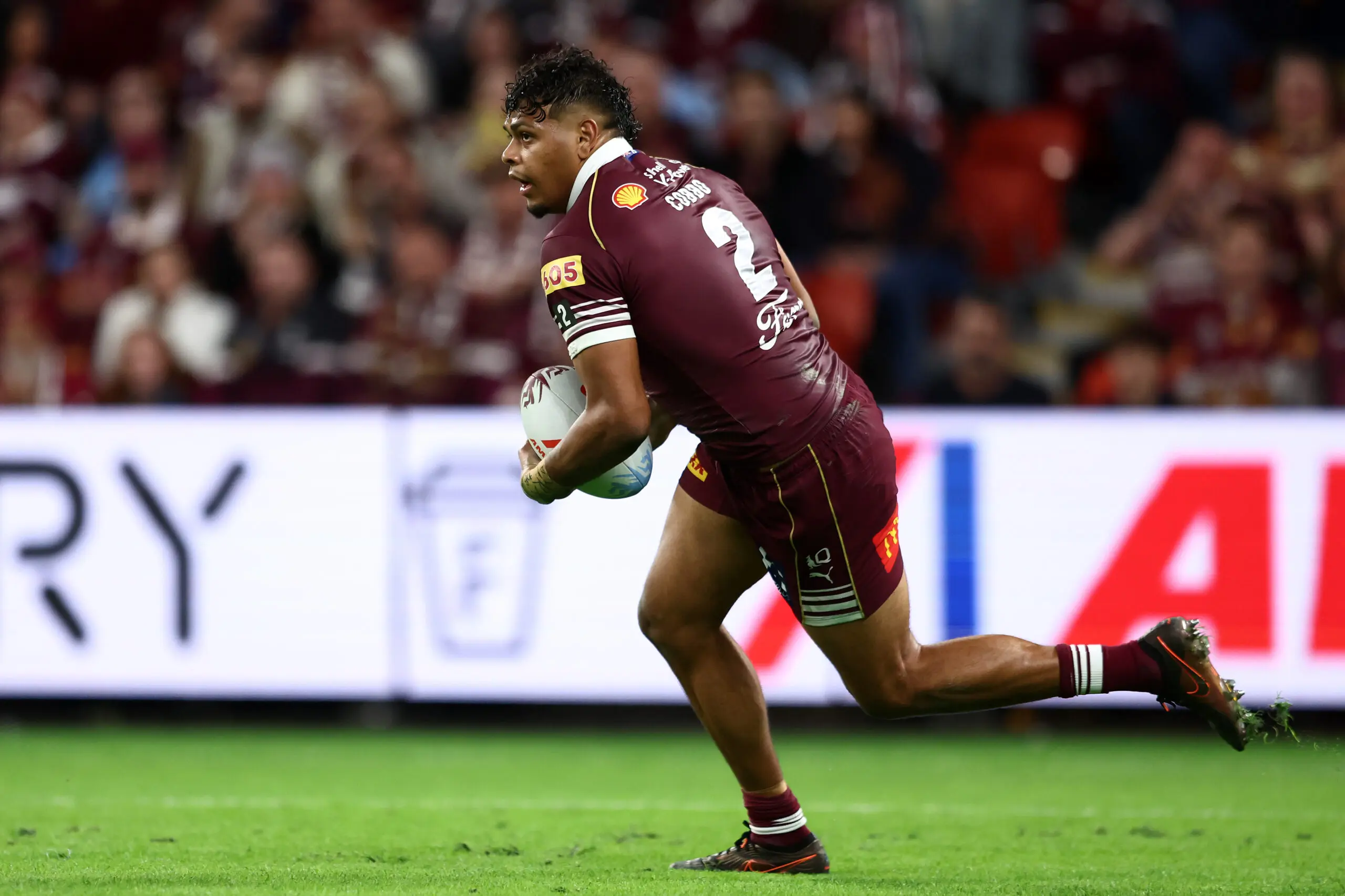 BRISBANE, AUSTRALIA - JULY 08: Selwyn Cobbo of the Maroons runs with the ball during game three of the Men's State of Origin series between the Queensland Maroons and the New South Wales Blues at Suncorp Stadium on July 08, 2026 in Brisbane, Australia. (Photo by Chris Hyde/Getty Images)
