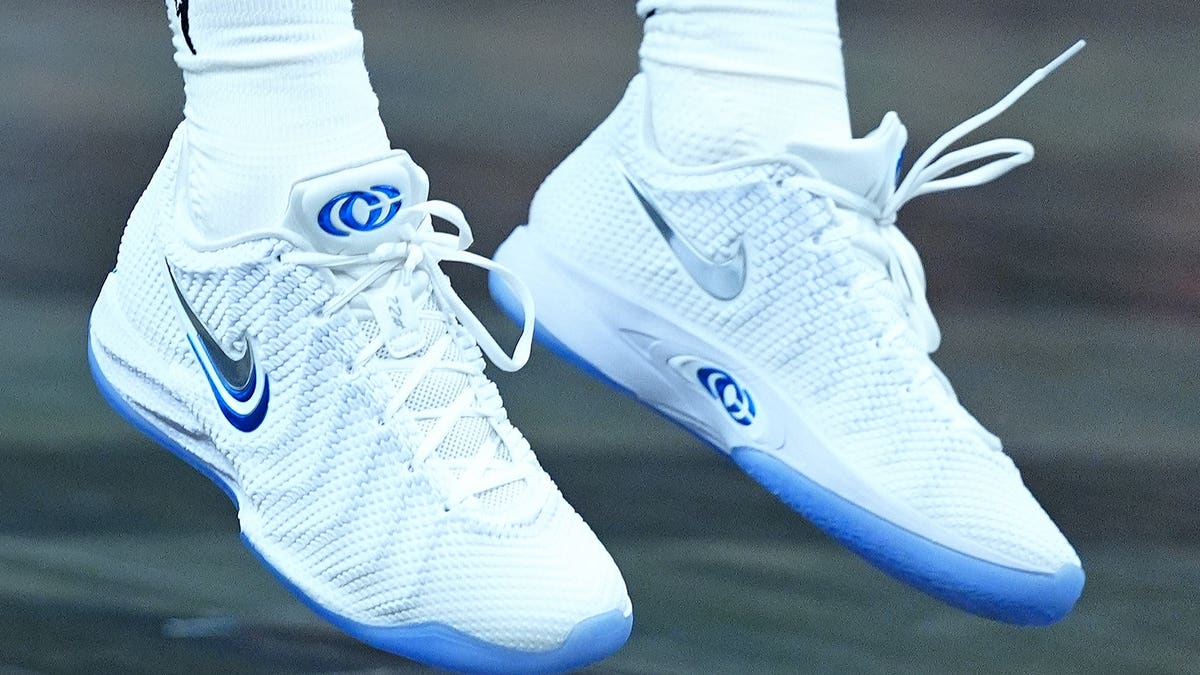 Caitlin Clark wears white Nike shoes while warming up at Gainbridge Fieldhouse.