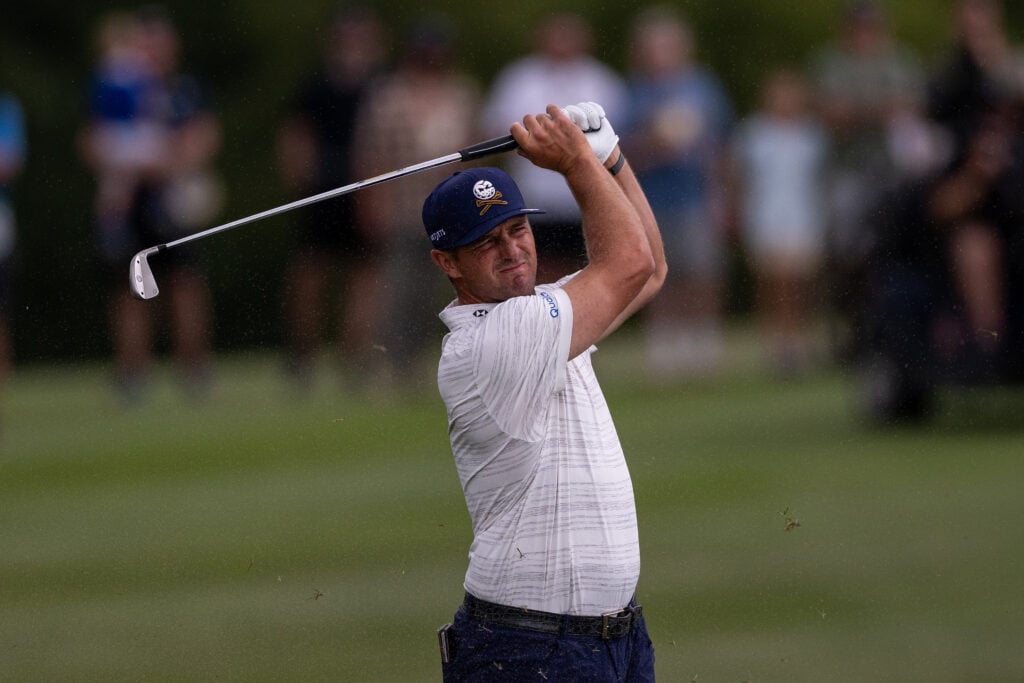 Bryson DeChambeau hits his approach into the 10th hole at JCB during the third round of LIV Golf UK