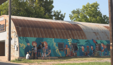 Rapoport Academy students paint mural on The Hangar in Downtown Waco