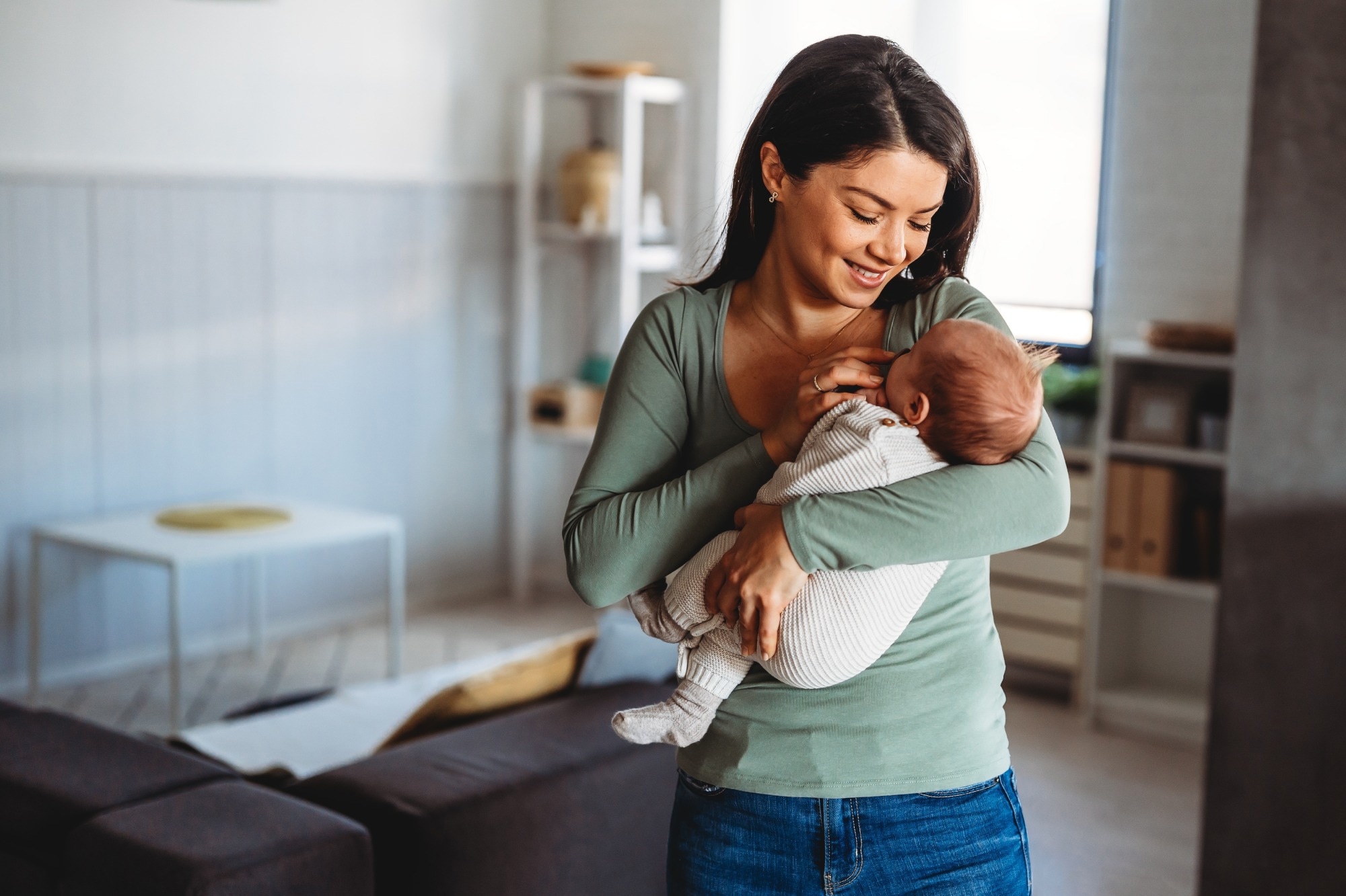 Happy mother holding adorable baby