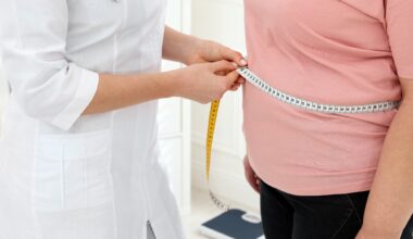 Nutritionist measuring overweight woman