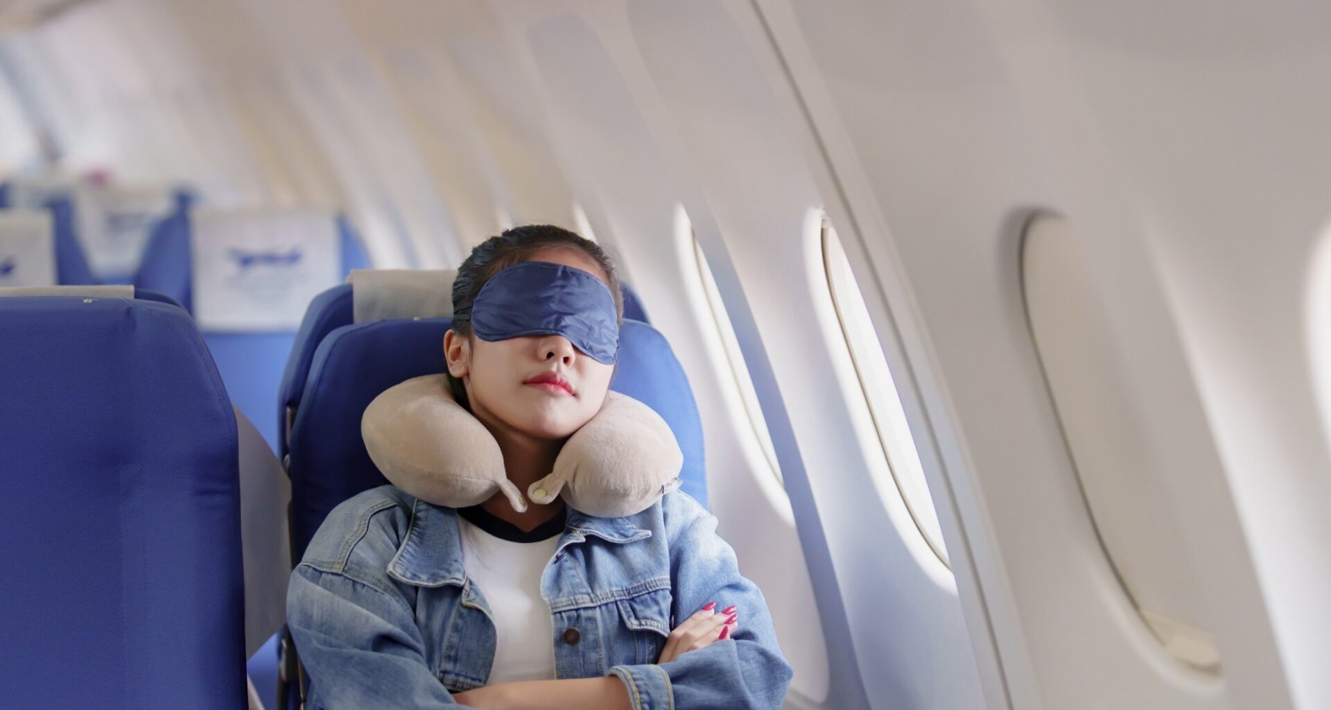 Female passenger sleep on plane flight