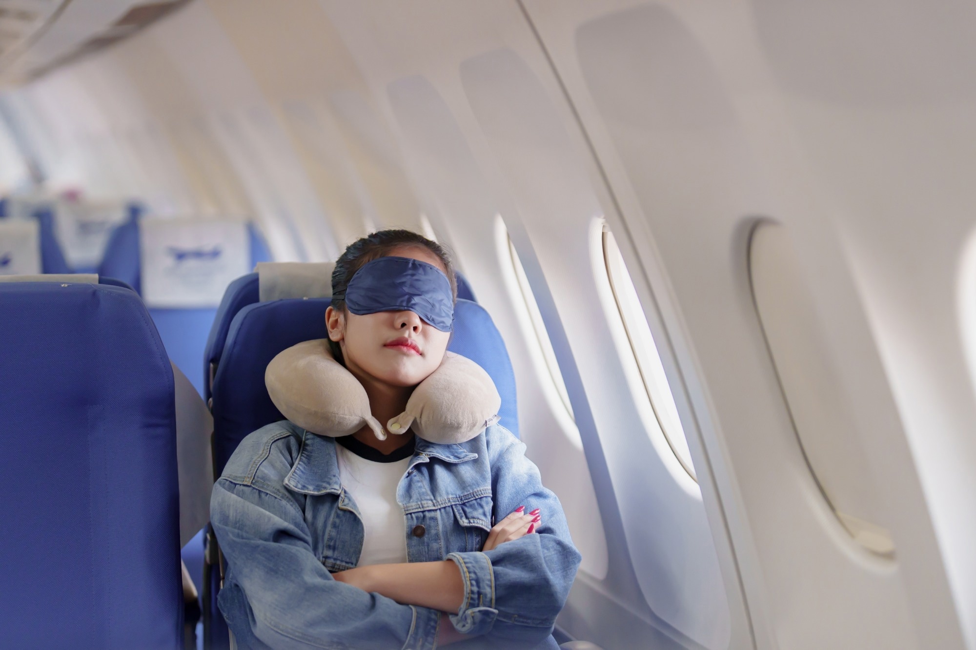 Female passenger sleep on plane flight