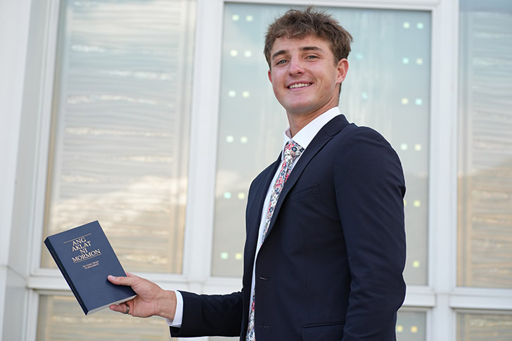 Missionary JJ Tomsick holds the Book of Mormon outside the temple as he prepares to serve a Mission in the Philippines Olongapo Mission. His missionary farewell talk centers on Jesus Christ, the Atonement of Jesus Christ, and the transforming power of grace.
