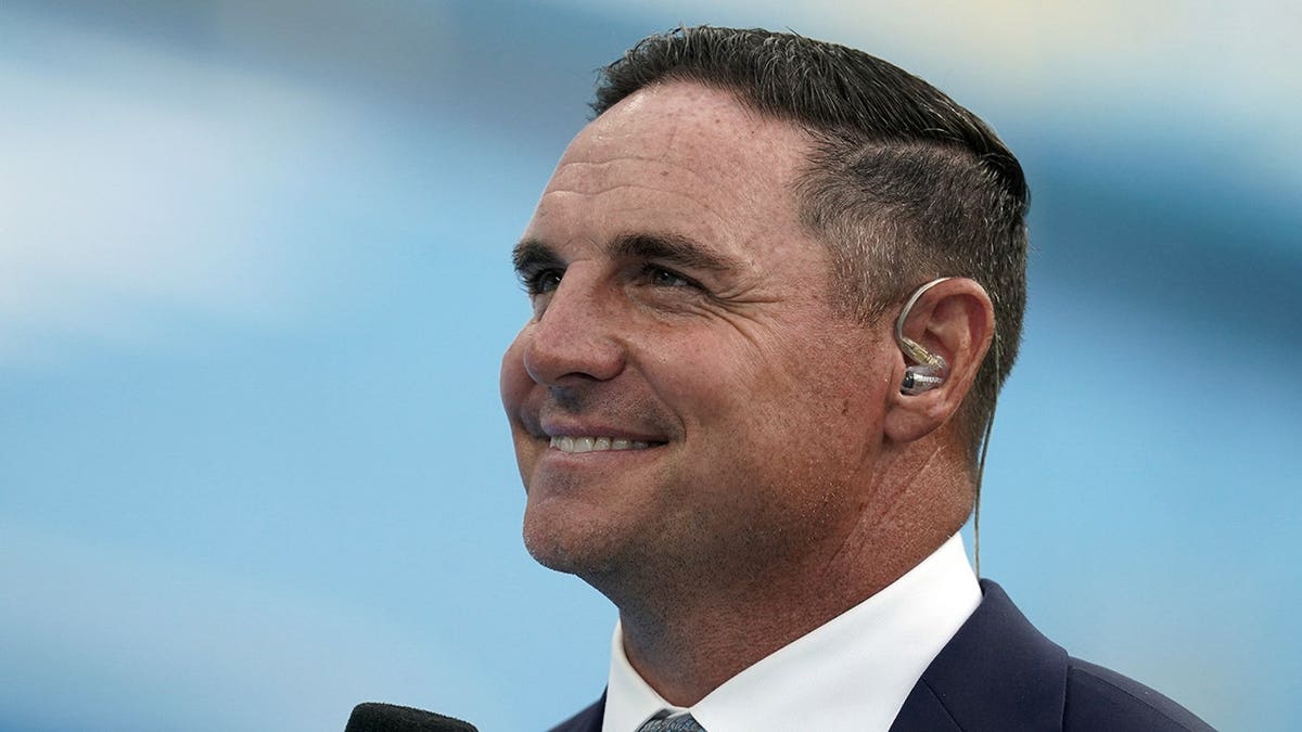 Jay Feely stands on the sideline at SoFi Stadium.