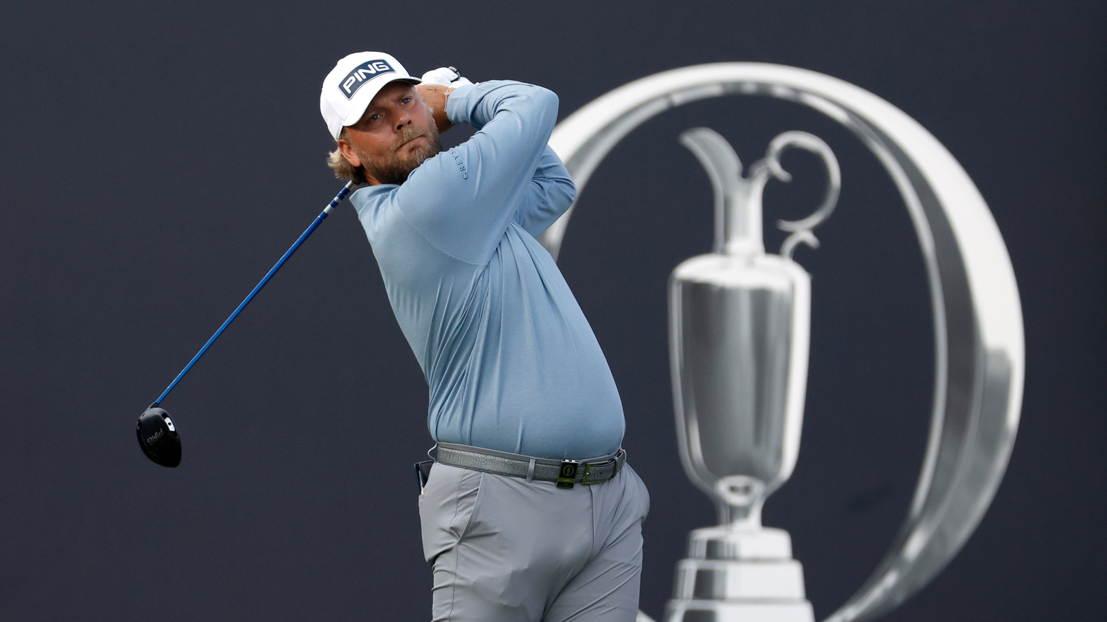 Daniel Brown hits a tee shot with a driver