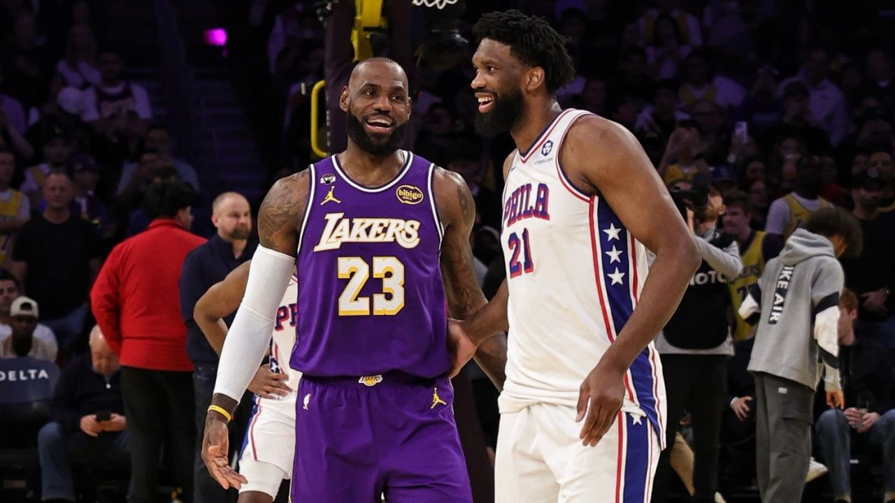 LOS ANGELES, CA - FEBRUARY 5: Joel Embiid #21 of the Philadelphia 76ers and LeBron James #23 of the Los Angeles Lakers smiles before the game on February 5, 2026 at Crypto.Com Arena in Los Angeles, California. (Photo by Jim Poorten/NBAE via Getty Images)