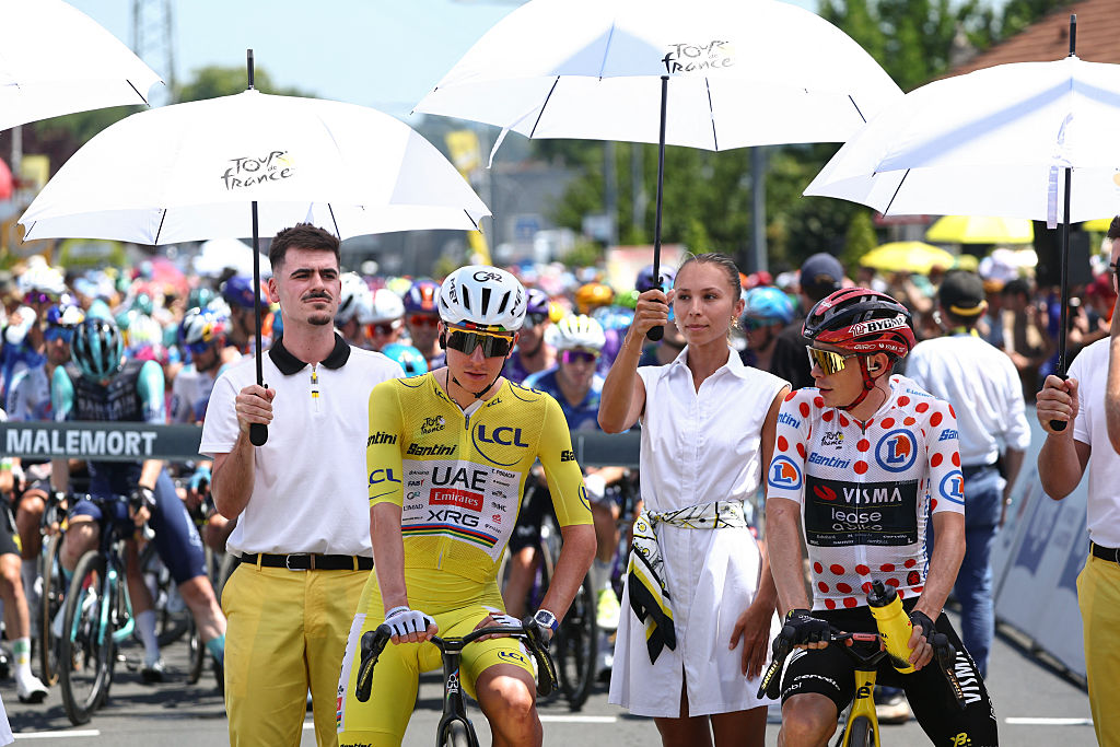 CYCLING-TDF-2026-STAGE 9UAE Team Emirates - XRG's Slovenian rider Tadej Pogacar wearing the overall leader's yellow jersey and Team Visma | Lease a Bike's Danish rider Jonas Vingegaard