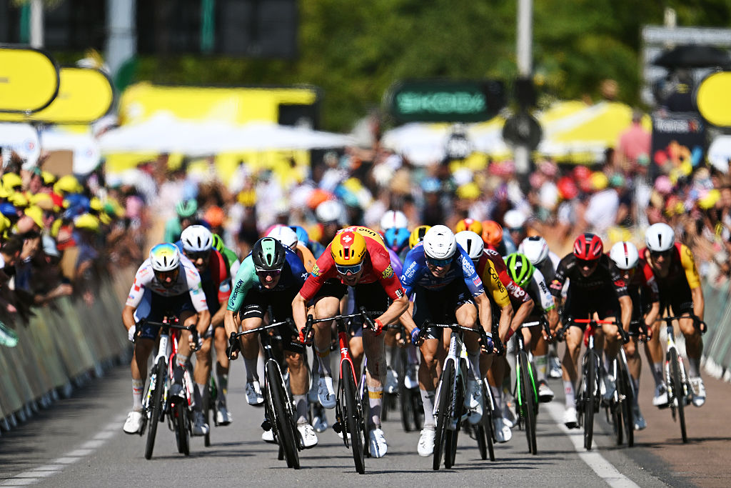 NEVERS, FRANCE - JULY 15: (L-R) Olav Kooij of Netherlands and Decathlon CMA CGM Team, stage winner Soren Waerenskjold of Norway and Team Uno-X Mobility, Jasper Philipsen of Belgium and Team Alpecin-Premier Tech and Milan Fretin of Belgium and Team Cofidis sprint at finish line during the 113th Tour de France 2026, Stage 11 a 161.3km stage from Vichy to Nevers / #UCIWT / on July 15, 2026 in Nevers, France. (Photo by Dario Belingheri/Getty Images)