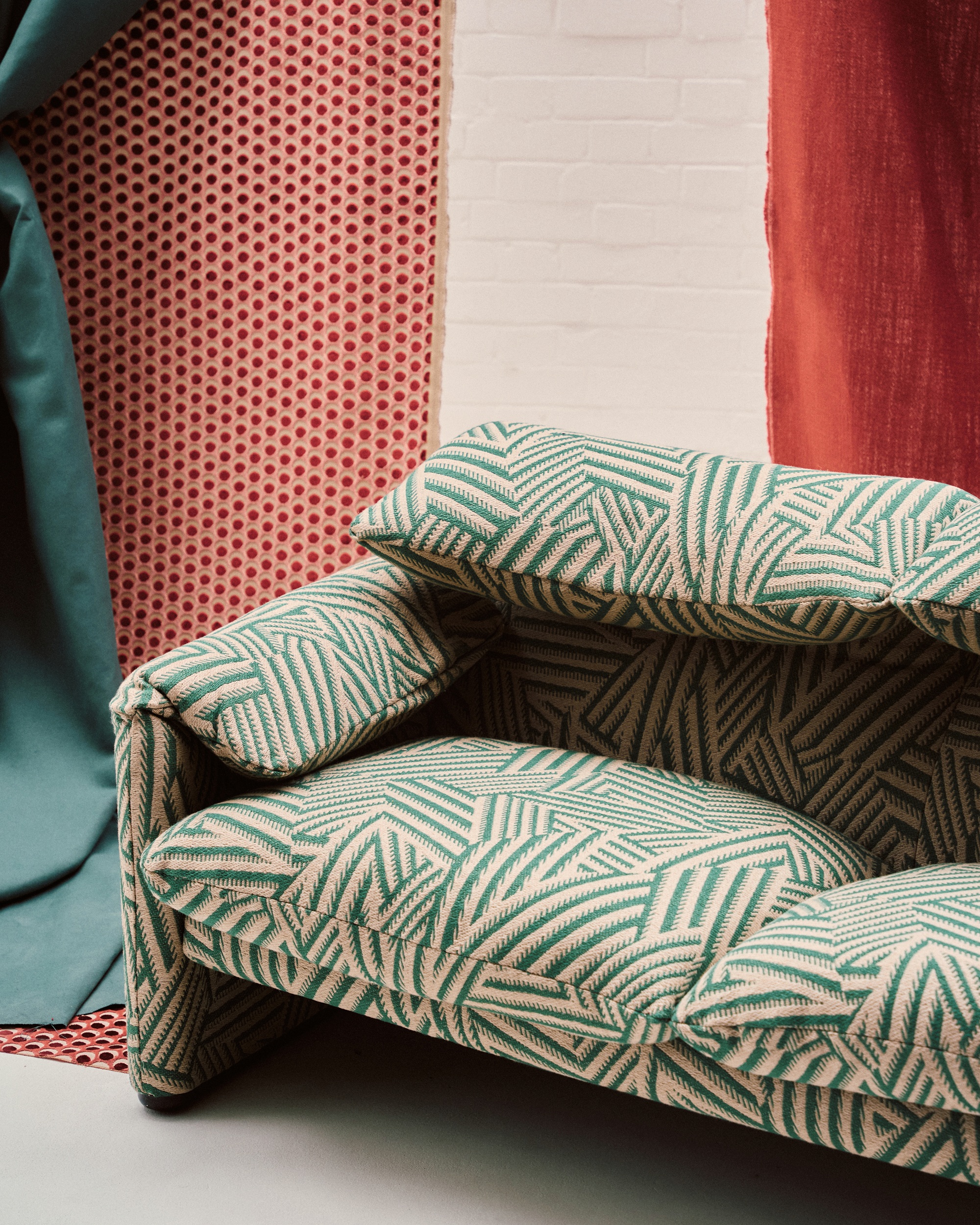 a sofa upholstered in a green liberty print