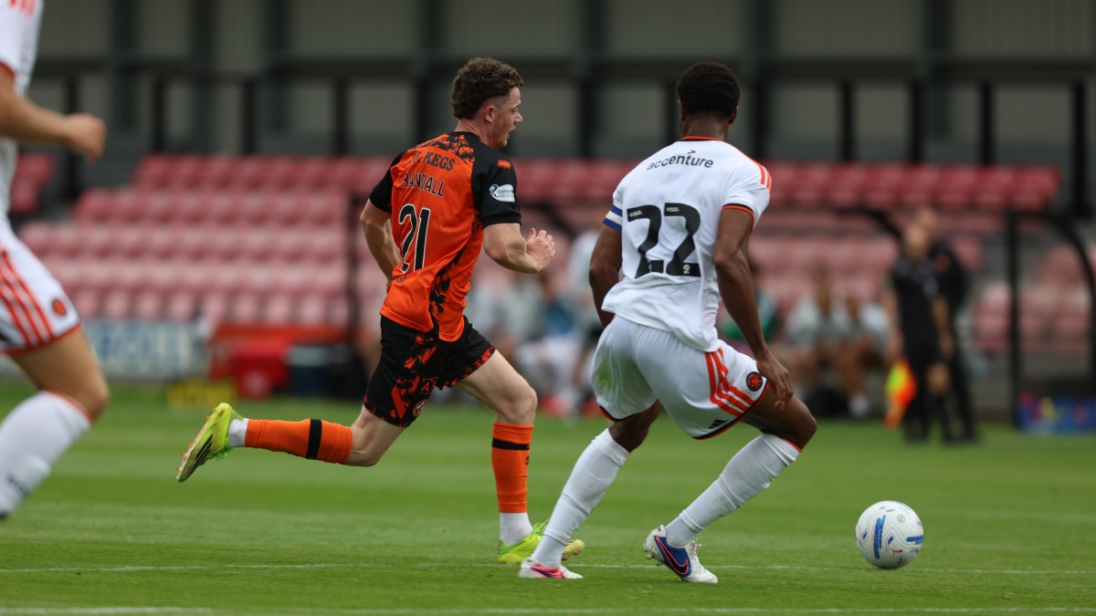 Jesse Randall with a bursting run in the box 