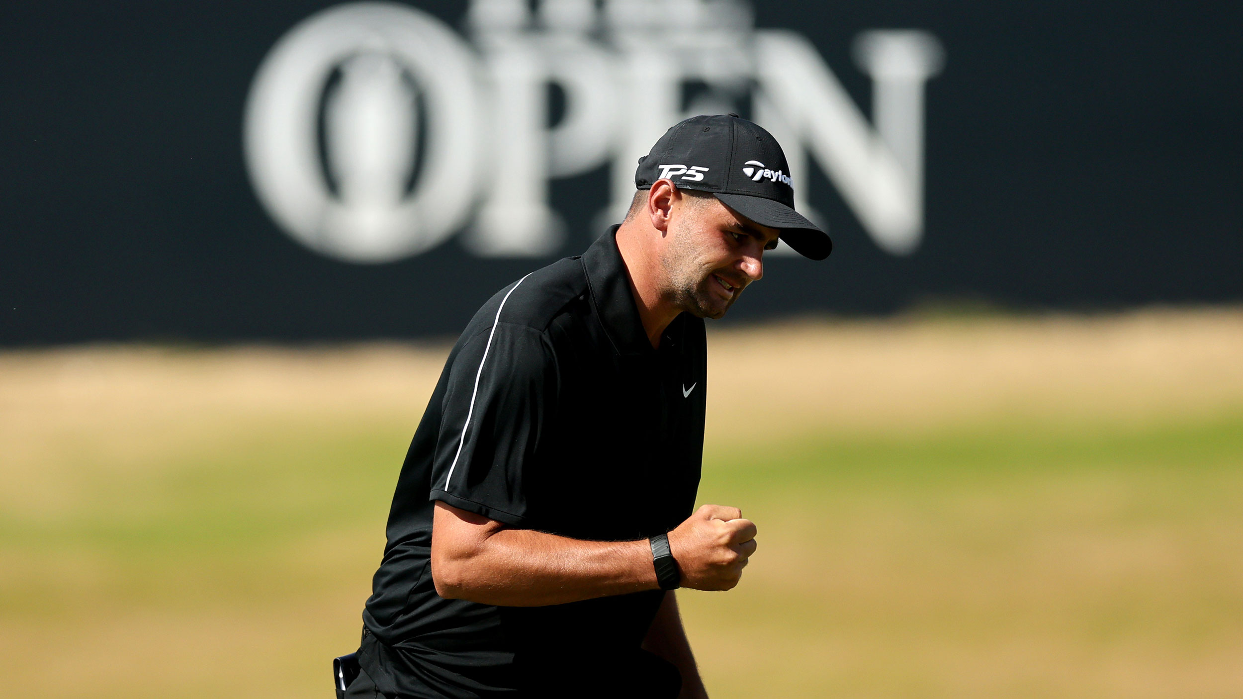 Casey Jarvis punches the air after holing a crucial putt to lock up a top-10 at The Open in 2026