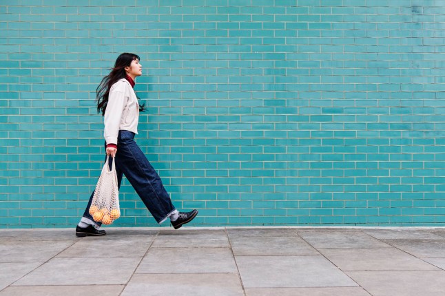 Young woman walking in the city.