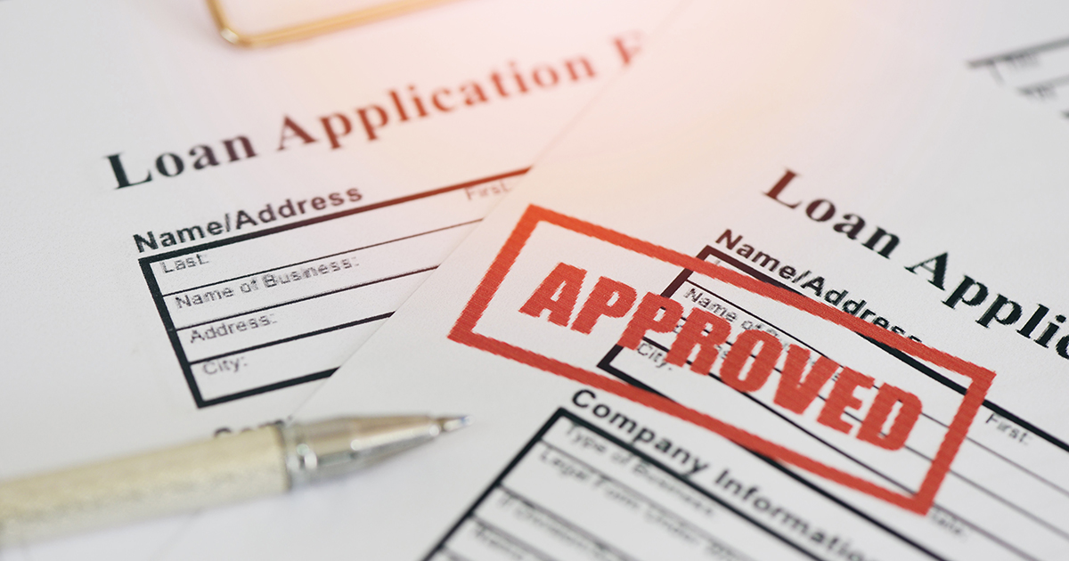 Loan approval, Loan application form with Rubber stamping that says Loan Approved, Financial loan money contract agreement company credit or person