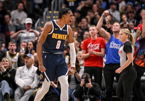 Peyton Watson (8) of the Denver Nuggets roars after dunking against the Utah Jazz during the first quarter at Ball Arena in Denver, Colorado on Monday, December 22, 2025. (Photo by AAron Ontiveroz/The Denver Post)
