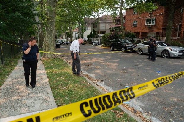 NYPD detectives are pictured at the scene after Julia Anderson was fatally shot on Murdock Ave. near Nereid Ave. in the Bronx late Monday, July 13, 2026. (