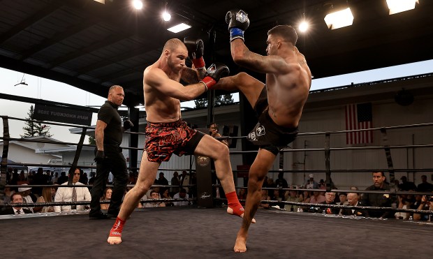 Kickboxers Matt Baker, left, and Kavem Felipe square off in the final round of their bout, during the inaugural Napa Knockout at Raymond Vineyards near St. Helena, Saturday, July 25, 2026. Baker won the fight. (Kent Porter / The Press Democrat)
