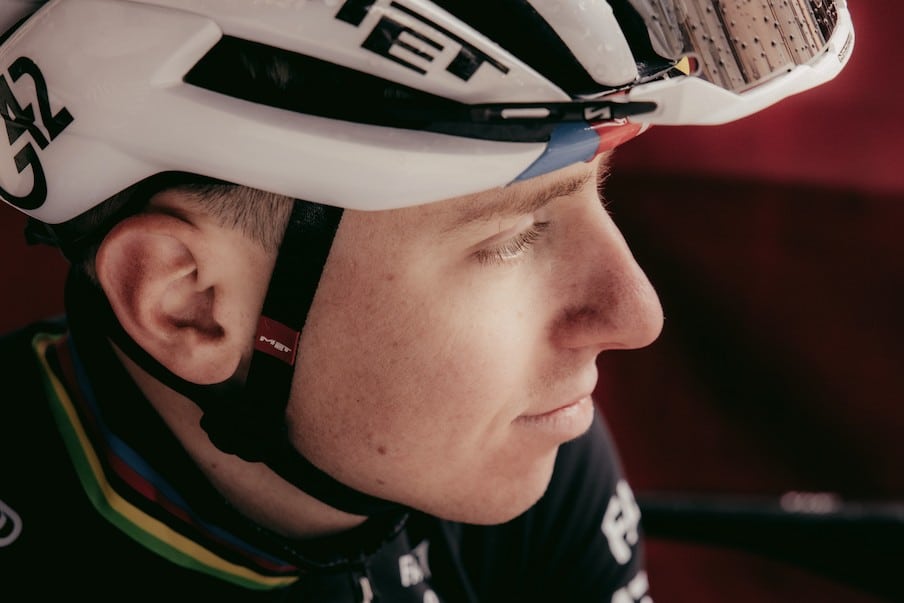 Tadej Pogacar in a MET helmet and UAE Team Emirates world champion kit