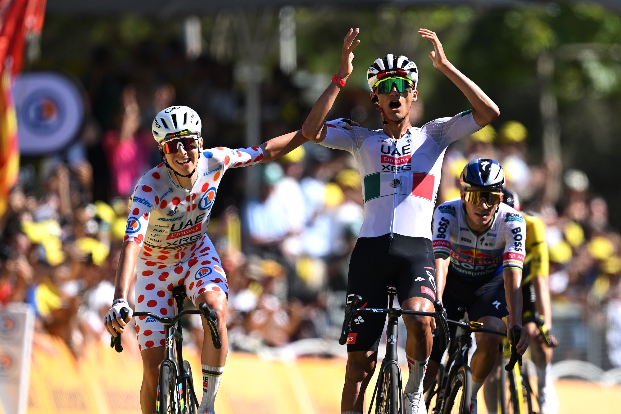 BARCELONA, SPAIN - JULY 05: (L-R) Tadej Pogacar of Slovenia - Polka dot Mountain Jersey and stage winner Isaac Del Toro of Mexico and UAE Team Emirates - XRG celebrate at finish line during the 113th Tour de France 2026, Stage 2 a 168.5km stage from Tarragona to Barcelona 109m / #UCIWT / on July 05, 2026 in Barcelona, Spain. (Photo by Tim de Waele/Getty Images)