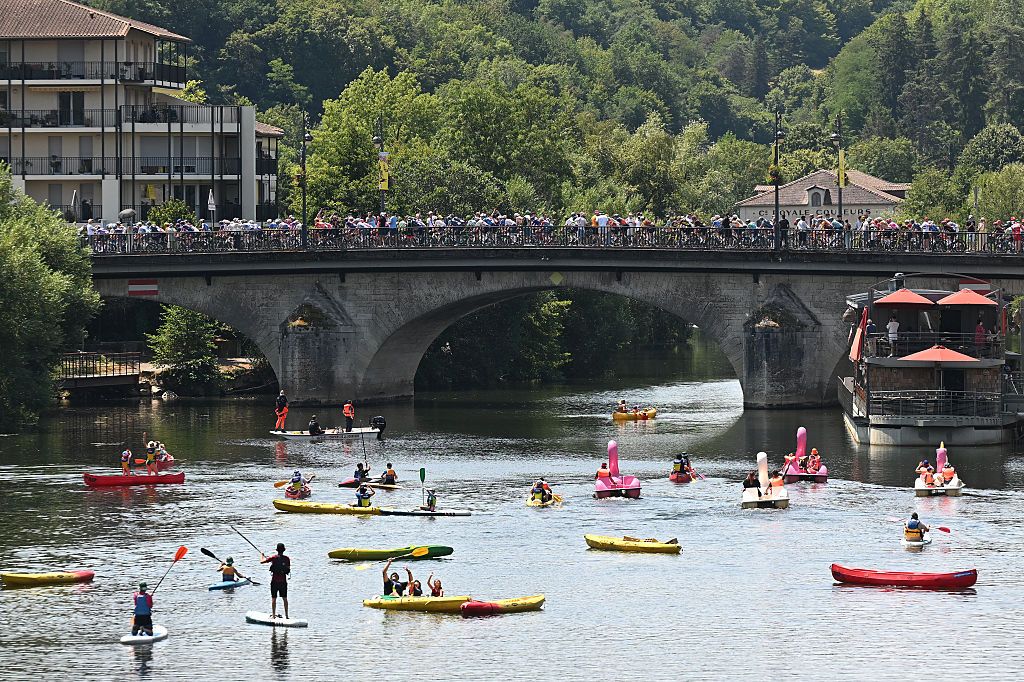 PERIGUEUX, FRANCE - JULY 11: A general view of the peloton passing through a Perigueux while fans cheers prior to the 113th Tour de France 2026, Stage 8 a 180.4km stage from Perigueux to Bergerac / #UCIWT / on July 11, 2026 in Perigueux, France. (Photo by Tim de Waele/Getty Images)