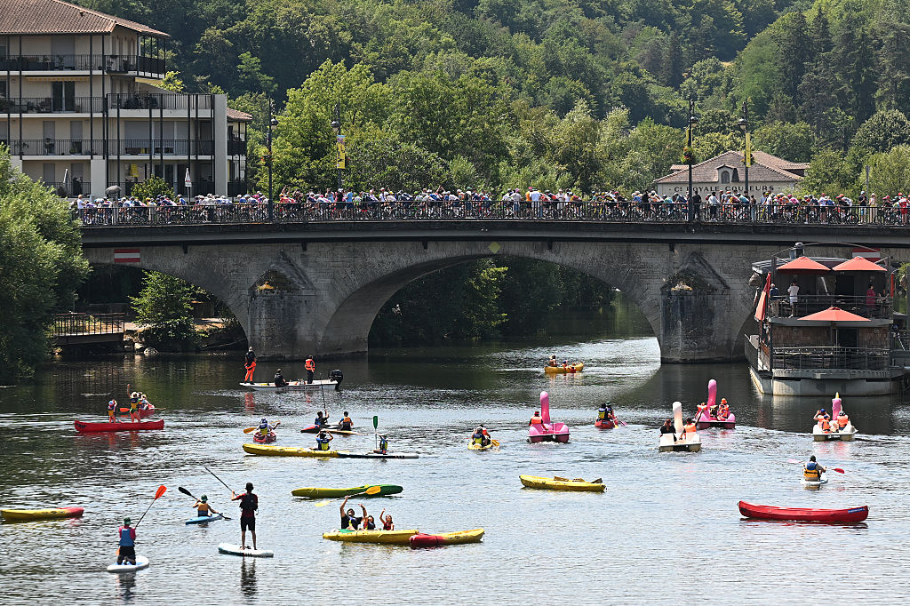 PERIGUEUX, FRANCE - JULY 11: A general view of the peloton passing through a Perigueux while fans cheers prior to the 113th Tour de France 2026, Stage 8 a 180.4km stage from Perigueux to Bergerac / #UCIWT / on July 11, 2026 in Perigueux, France. (Photo by Tim de Waele/Getty Images)
