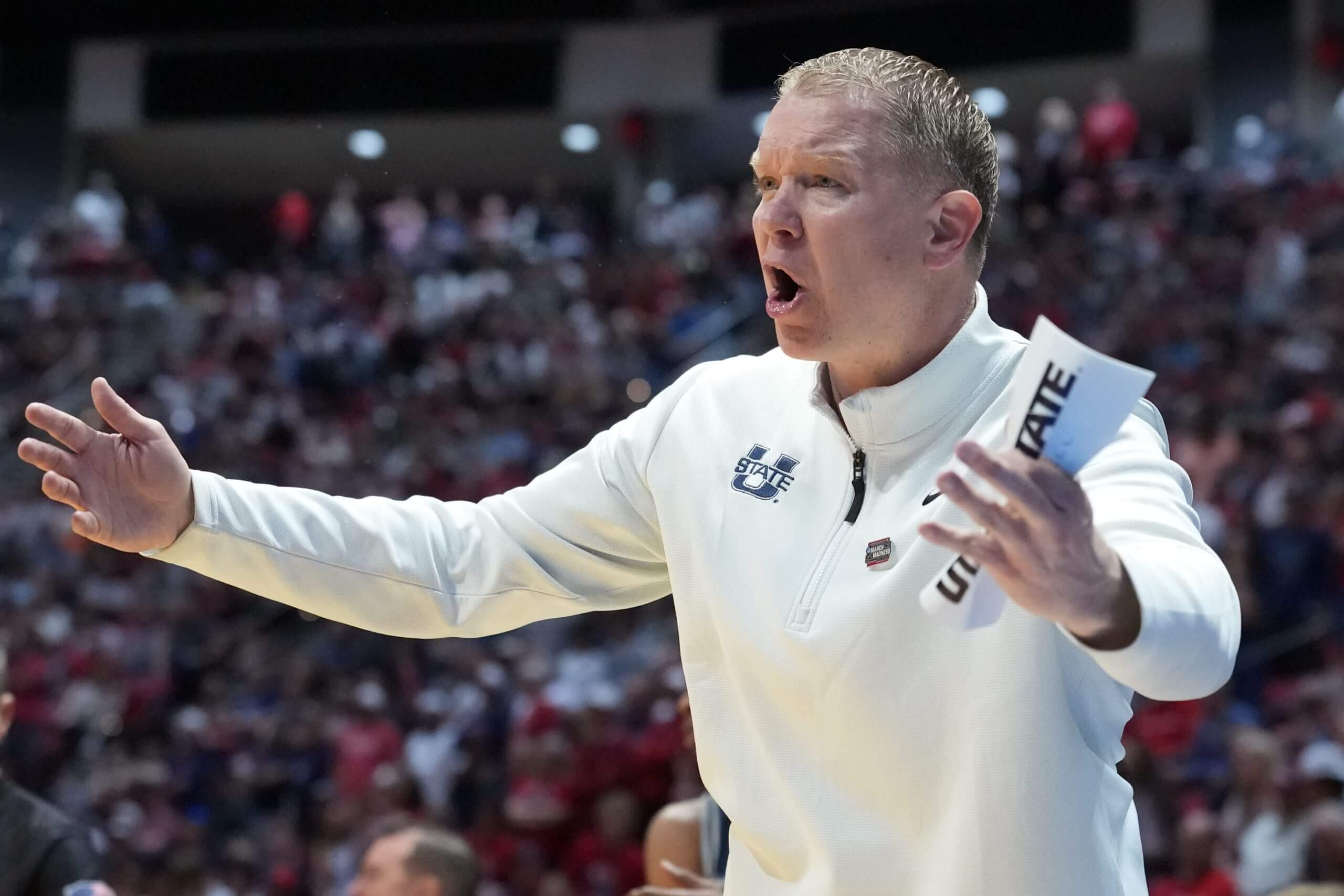 Utah State head coach Jerrod Calhoun reacts.