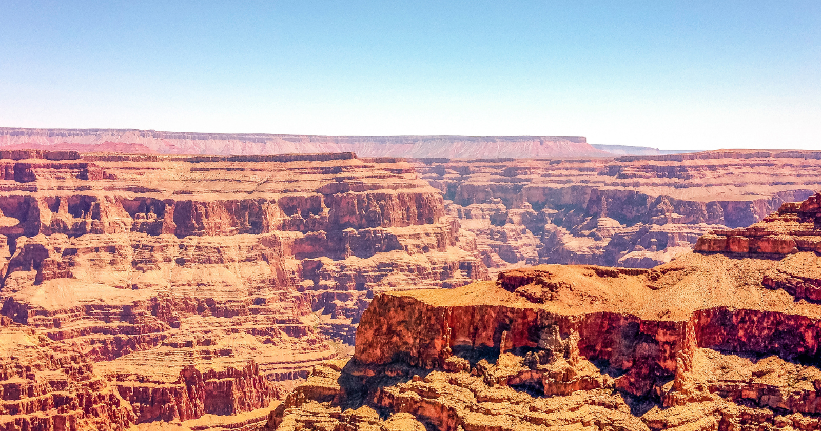 The Grand Canyon looks vast until you set it beside Valles Marineris on Mars, a single rift so long it would stretch clear across the United States and in places plunges up to seven kilometres deep, making it the largest canyon in the solar system