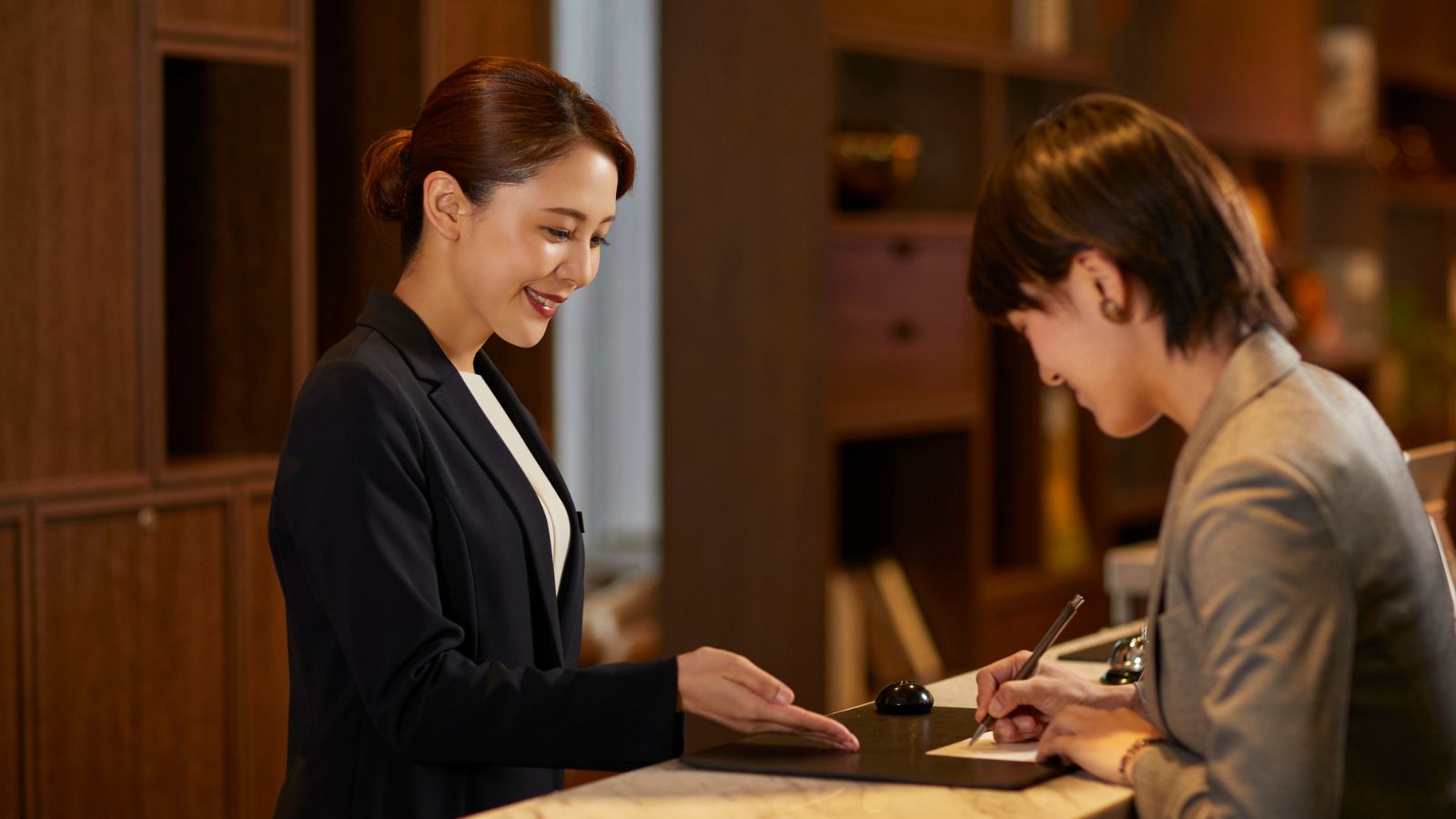 Woman at hotel reception