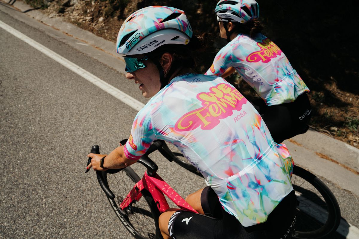 New Canyon-SRAM kit, featuring a light white background with colorful accents of pink, blue, orange and green, plus a pink and yellow 'We Femmes' logo