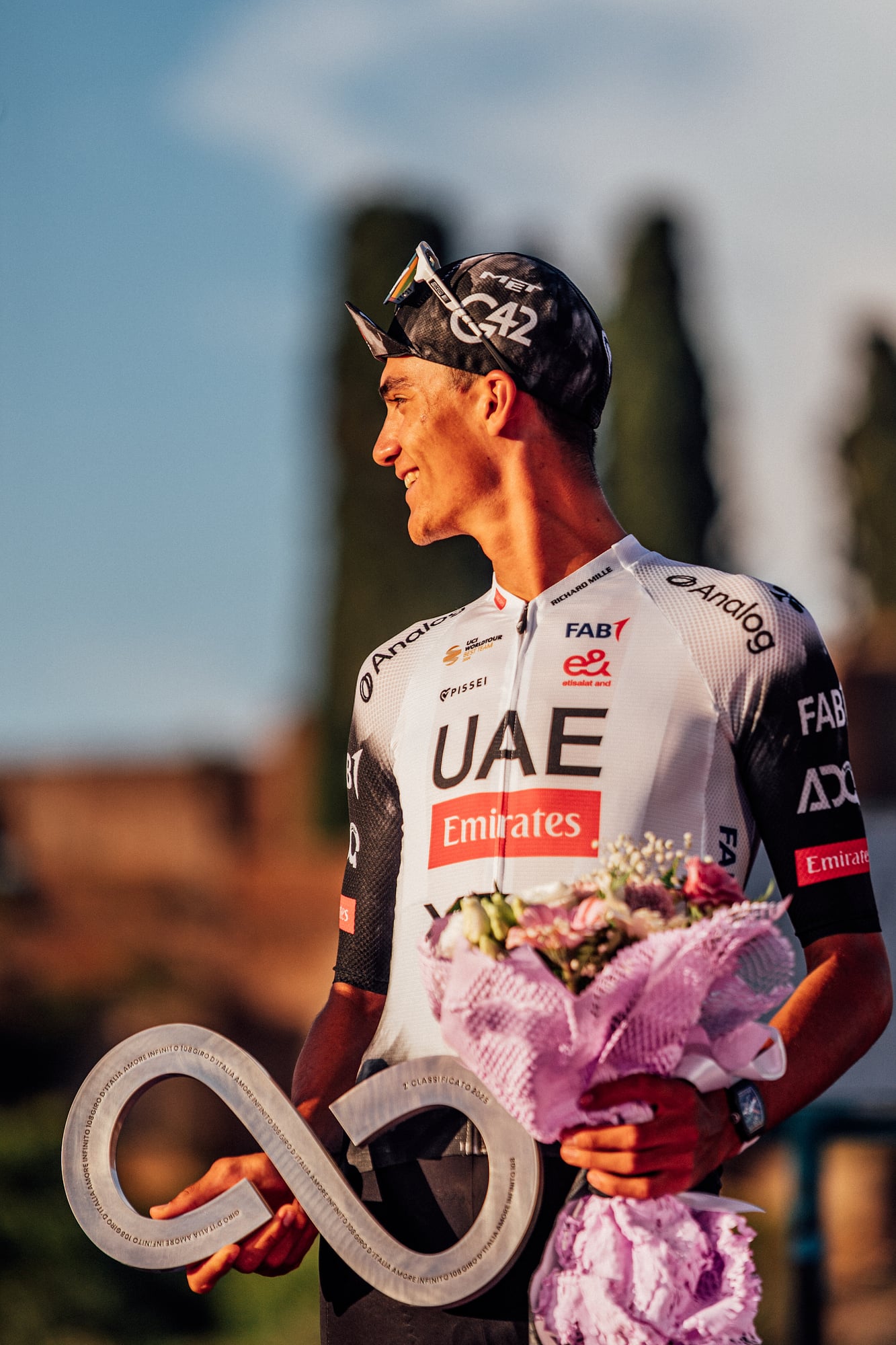 Isaac del Toro of UAE Team Emirates holds the runner-up trophy at the 2025 Giro d'Italia