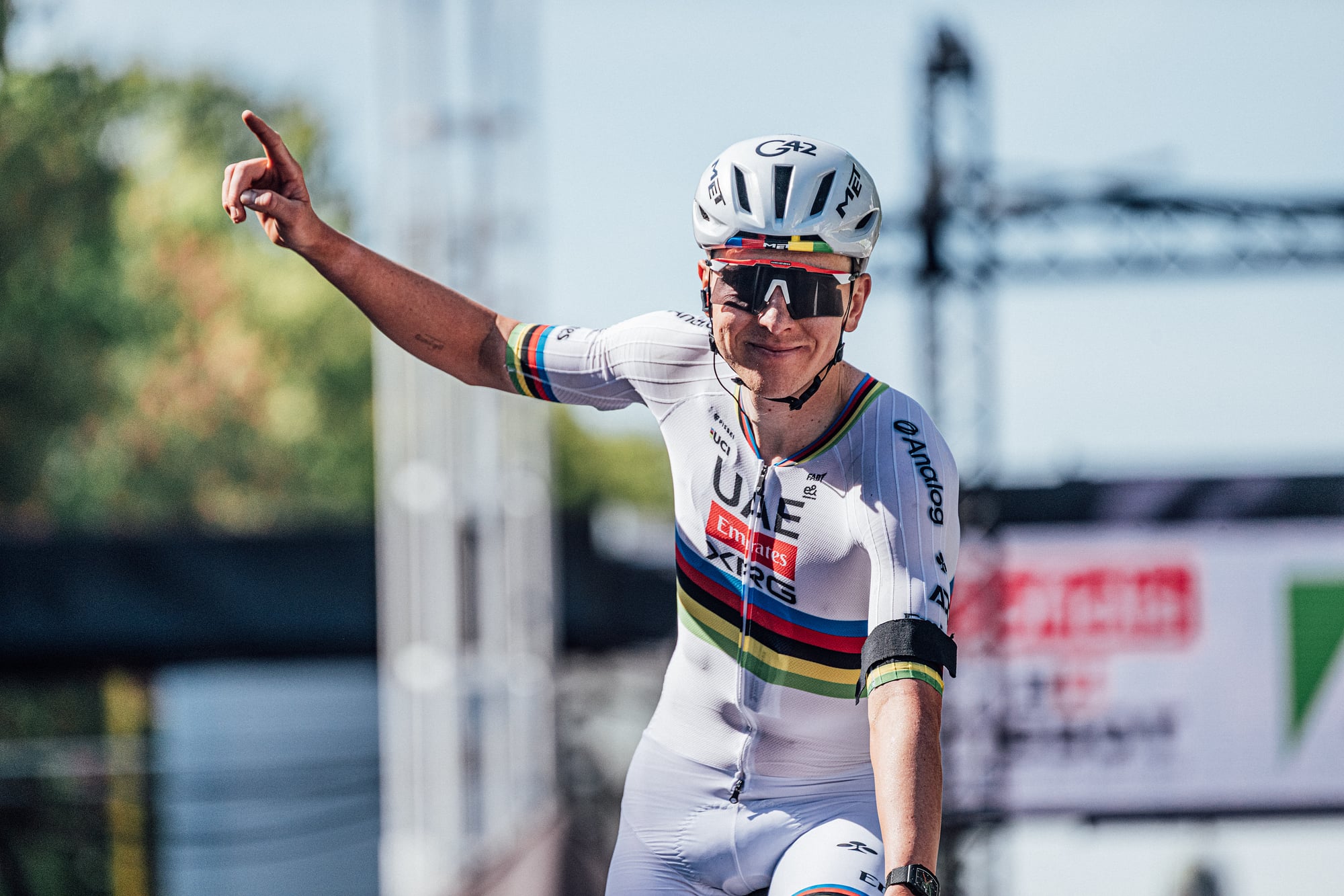 Tadej Pogačar celebrates a win in the rainbow jersey of world champion