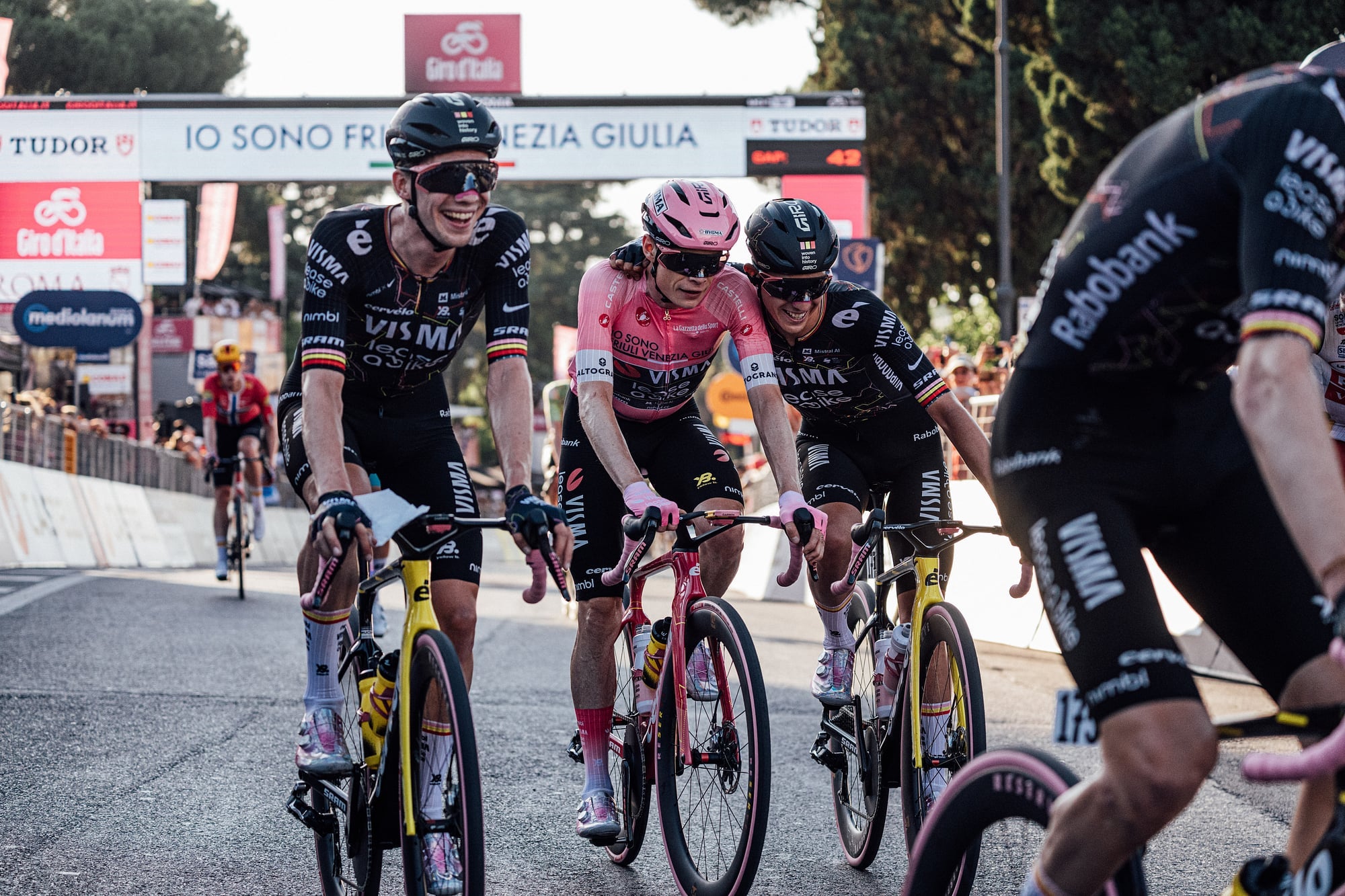 Jonas Vingegaard in the pink jersey escorted by Visma-Lease a Bike teammates in Rome at the 2026 Giro d'Italia