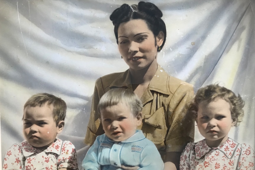 Dulcie Sansbury poses with her children Helga, Kaarlo and Anya.