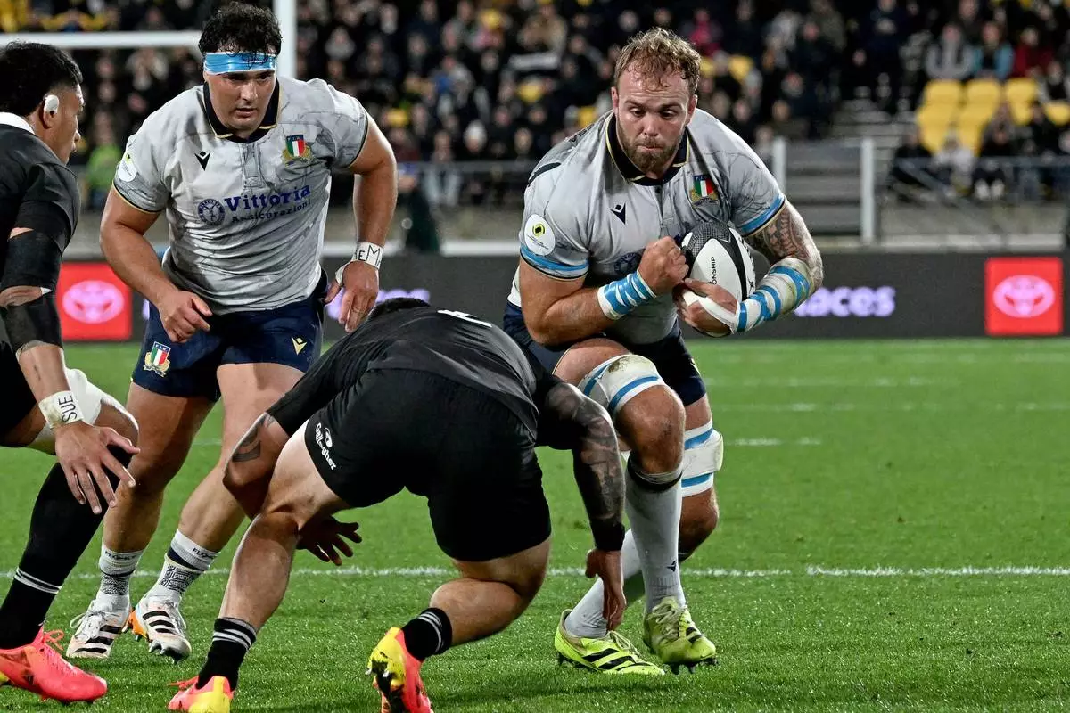 Italy's Niccolo Cannone runs at the defence during the Nations Championship rugby international between the All Blacks and Italy in Wellington, New Zealand, Saturday, July 11, 2026. (Masanori Udagawa/Photosport via AP)