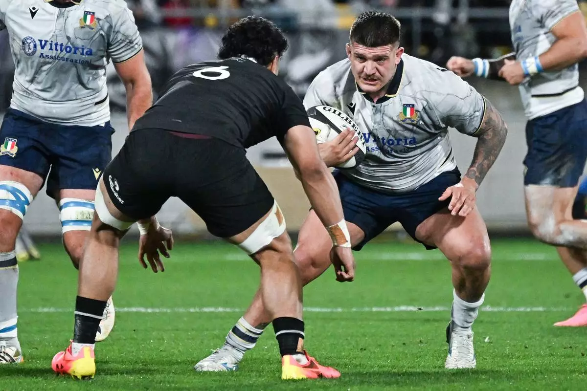 Italy's Marco Riccioni runs at New Zealand's Wallace Sititi during the Nations Championship rugby international between the All Blacks and Italy in Wellington, New Zealand, Saturday, July 11, 2026. (Masanori Udagawa/Photosport via AP)